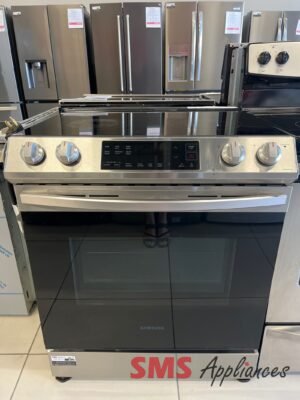 Samsung stainless steel range with glass cooktop on display in an appliance store, surrounded by multiple refrigerators in the background.